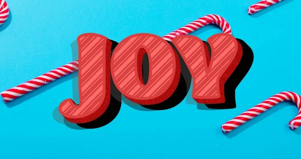 Sammansättning Glädje Text Över Godis Käppar Blå Bakgrund Vid Jul — Stockfoto