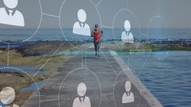 Sahilde koşan yaşlı Afro-Amerikan bir adam üzerinden bağlantı ağının animasyonu. sağlıklı, aktif yaşam tarzı, bağlantılar ve dijital arayüz konsepti dijital olarak oluşturulmuş video.