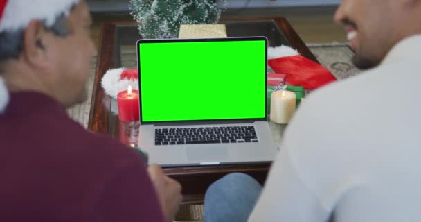 Smiling Biracial Father Son Santa Hats Making Laptop Christmas Video — Stock Video
