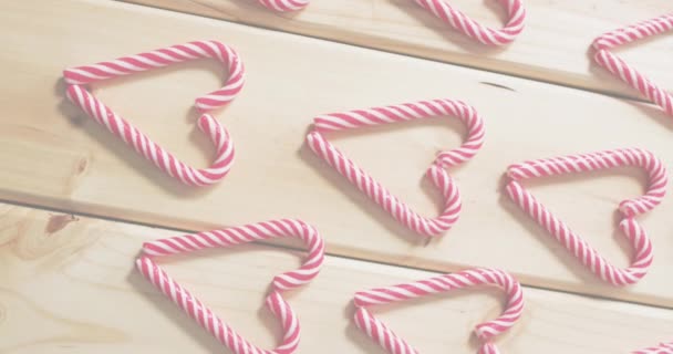 Animation Merry Christmas Happy New Year Text Candies Wooden Background — Stock Video