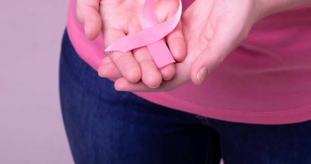 Video Midsection Caucasian Woman Holding Pink Cancer Awareness Ribbon Breast — Stock Video