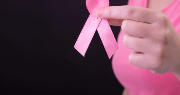 Video Midsection Caucasian Woman Holding Pink Cancer Awareness Ribbon Black — Stock Video