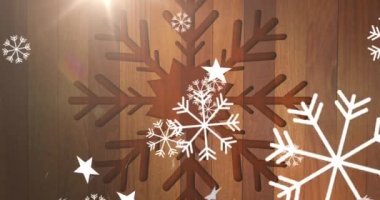 Ahşap arka planda düşen Noel kar tanelerinin animasyonu. Noel, gelenek ve kutlama konsepti dijital olarak oluşturuldu.
