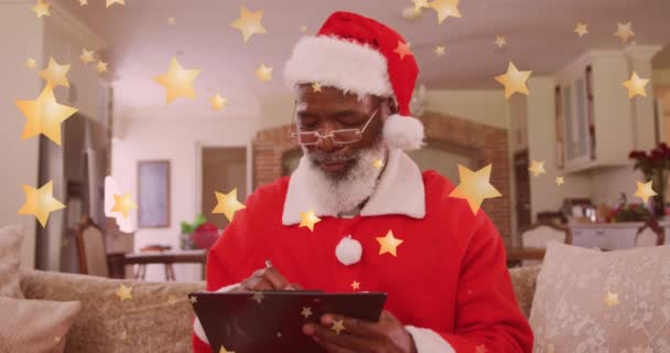 Animation Stars Falling Happy African American Man Wearing Santa Hat Video Clip