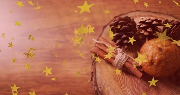 装飾や陽気なクリスマスのテキストで木製の背景に落ちる星のアニメーション クリスマス お祝いのコンセプトをデジタルで — ストック動画