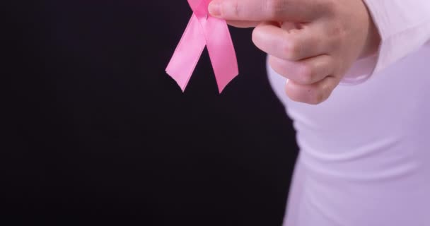 Video Midsection Caucasian Woman Holding Pink Cancer Awareness Ribbon Black — Stock Video