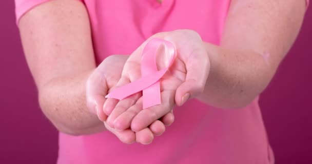 Video Midsection Caucasian Woman Holding Pink Cancer Awareness Ribbon Breast — Stock Video