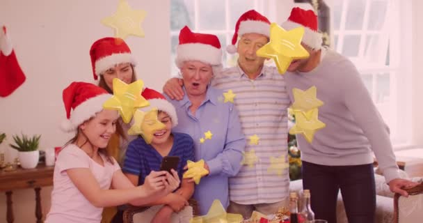 Animation Stars Falling Caucasian Family Wearing Santa Hats Taking Selfie — Stock Video