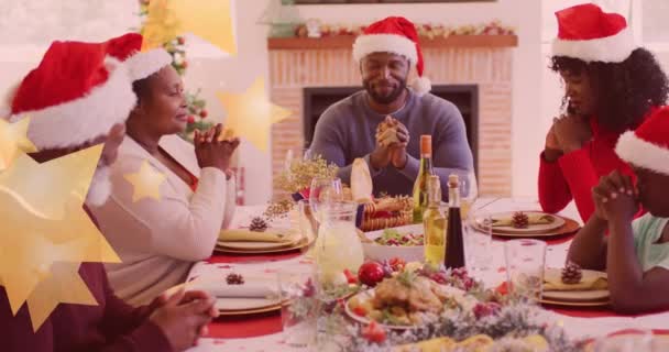 Animation Stars Falling Happy African American Family Wearing Santa Hats — Stock Video