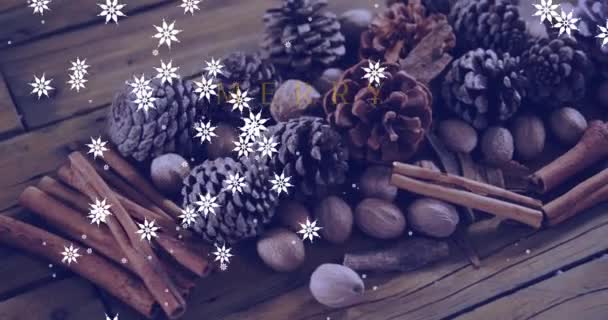 在松果和降雪之上的快乐圣诞文字的动画 圣诞节 传统和庆祝概念数字制作的视频 — 图库视频影像