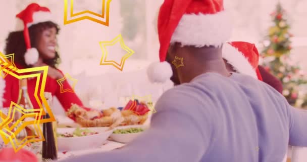 Animation Stars Falling Happy African American Family Wearing Santa Hats — Stock Video