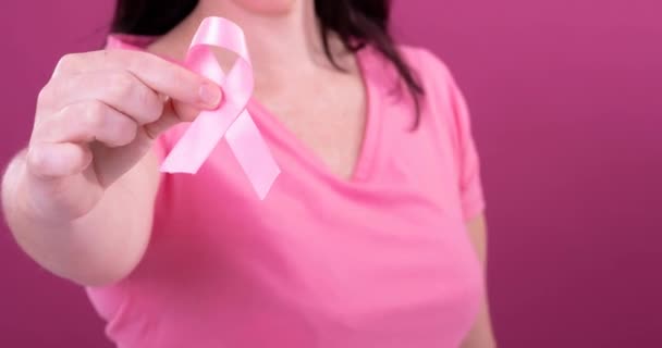 Video Midsection Caucasian Woman Holding Pink Cancer Awareness Ribbon Pink — Stock Video