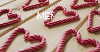 Noel 'de baston şekerlerle yazılmış mutlu noel mesajlarının animasyonu. Noel, gelenek ve kutlama konsepti dijital olarak oluşturuldu.