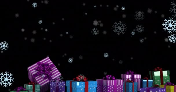 Animation Von Schnee Der Über Geschenke Auf Schwarzem Hintergrund Und — Stockvideo