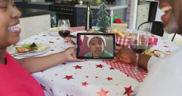 Smiling African American Couple Using Tablet Christmas Video Call Boy — Stok Video