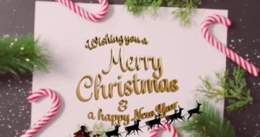 Şeker kamışları üzerine yazılmış mutlu noel mesajlarının animasyonu. Noel, kış, gelenek ve kutlama konsepti dijital olarak oluşturulmuş video.