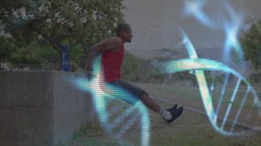 Parlayan DNA iplikçiklerinin dışarıda egzersiz yapan erkek sporcuların üzerinde dönüşünün animasyonu. spor, fitness ve teknoloji konsepti, dijital olarak üretilen video.
