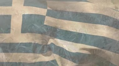 Buğday tarlasında dalgalanan Yunan bayrağının animasyonu. Vatanseverlik, bağımsızlık ve tarım kavramı dijital olarak üretilen video.