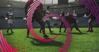 Maç sırasında erkek rugby oyuncuları üzerinde dönen kırmızı çizgi spiralinin animasyonu. spor ve yarışma konsepti, dijital olarak oluşturulmuş video.