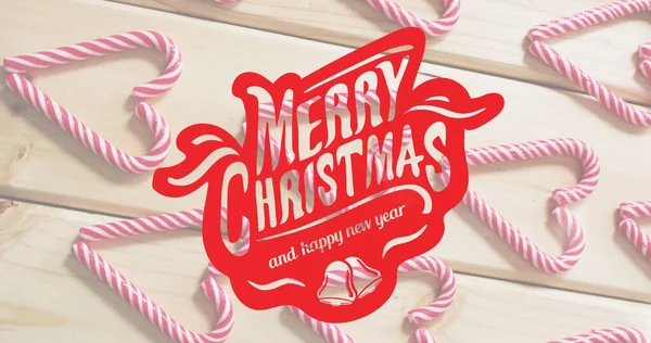 木制背景的糖果上挂着快乐的圣诞和快乐的新年祝福的图像 圣诞节 传统和庆祝概念数字生成的图像 — 图库照片