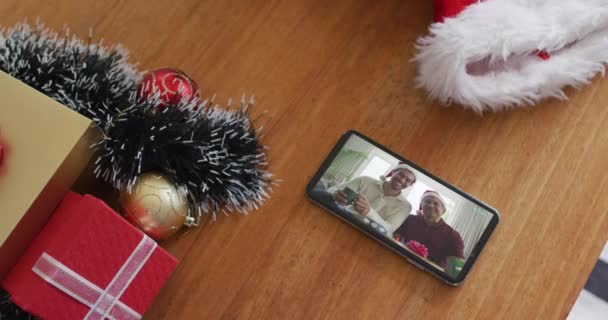 Smiling Biracial Father Son Santa Hats Christmas Video Call Smartphone — Stok Video