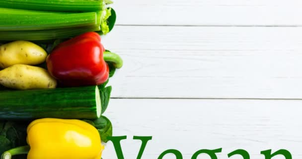 Animação Texto Vegan Verde Sobre Legumes Frescos Placas Brancas Dia — Vídeo de Stock