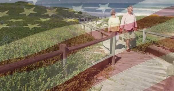 Animace Šťastného Staršího Bělošského Páru Držícího Ruce Pláži Vlajka Spojených — Stock video