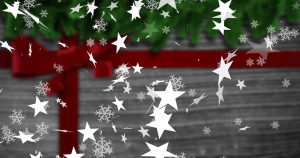 Imagen Copos Nieve Navideños Estrellas Cayendo Sobre Presente Navideño Navidad —  Fotos de Stock