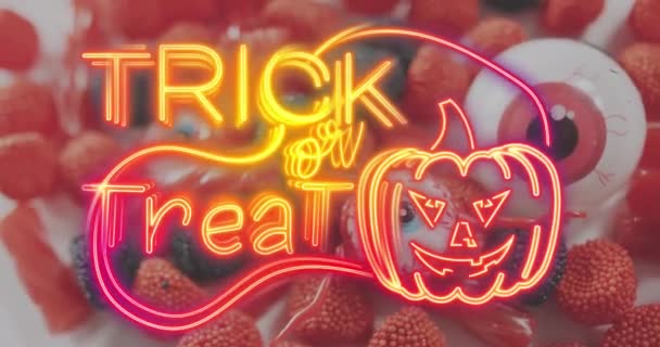 Korku Göz Oyuncakları Cadılar Bayramı Şekerlerine Karşı Balkabağı Ikonuyla Neon — Stok video