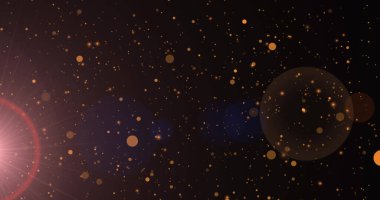 Siyah arkaplana düşen güneş ışığı ve altın noktaların görüntüsü. Kutlama ve şenlik kavramı dijital olarak oluşturuldu.