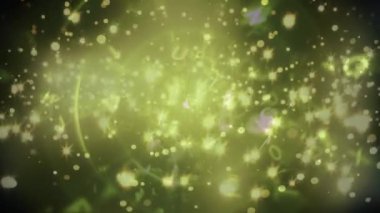 Sarı parlak noktalı ve dönen daireli Noel dekorasyonunun animasyonu. Noel, yeni yıl, gelenek ve kutlama konsepti dijital olarak oluşturulmuş video.