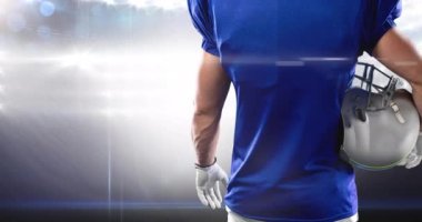 Amerikan futbolcusunun göbek kısmındaki ışıkların animasyonu Stadyum 'da kask tutuyor. Spor, rekabet, Amerikan futbolu konsepti dijital olarak üretilen video.