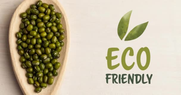 木の板の上で新鮮な有機的な緑の芽の上に緑の環境に優しいテキストのアニメーション ビーガンの日有機ビーガン製品と健康的な食事のコンセプトデジタル生成されたビデオ — ストック動画