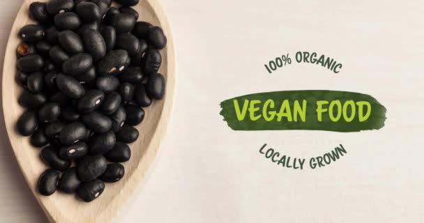 Animación Texto Comida Vegana Verde Sobre Frijoles Negros Orgánicos Frescos — Vídeos de Stock