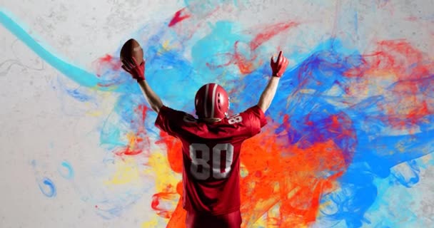 Animation American Football Player Holding Ball Abstract Colourful Painted Background — Stock Video