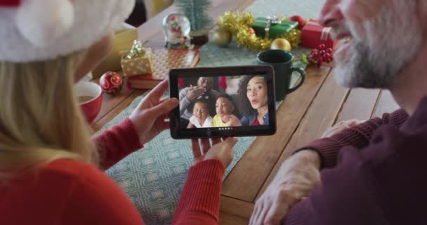 Smiling Caucasian Couple Santa Hats Using Tablet Christmas Video Call — Stock Video