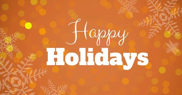 オレンジの背景に雪の結晶とレンズフレアの上の幸せな休日のテキスト デジタル コンポジットとクリスマスのお祝い — ストック写真