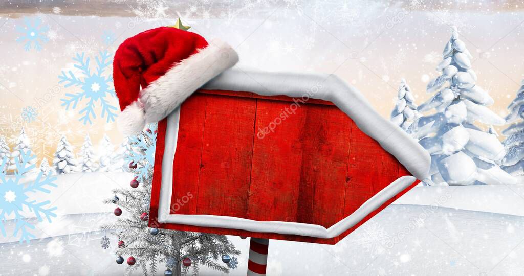 Composite image of santa hat on blank red directional sign board with copy space during winter. christmas festivity, tradition and winter holiday.