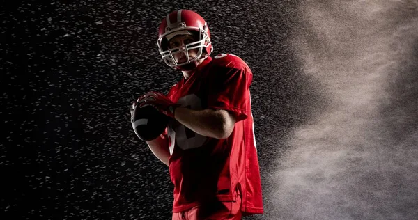 Male American Football Athlete Holding Ball Black Background Mist Competitive — Stock Photo, Image