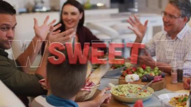 Memleketteki yemek masasında konuşan mutlu çok nesilli aile yerine kırmızıyla yazılmış tatlı metnin animasyonu. aile, birliktelik ve refah konsepti dijital olarak oluşturulmuş video.