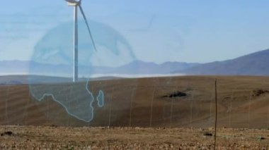 Kırsal kesimde rüzgar türbininin üzerindeki dünyanın animasyonu. küresel ısınma, iklim değişikliği, rüzgar enerjisi ve sürdürülebilirlik kavramı dijital olarak oluşturulmuş video.