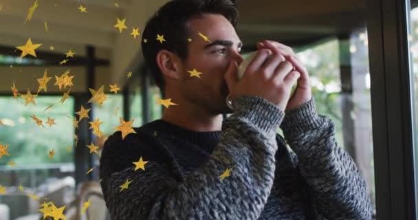 Animation Gold Stars Thoughtful Caucasian Man Enjoying Coffee Home Relaxation — Stock Video