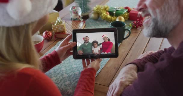 Caucasian Couple Santa Hats Using Tablet Christmas Video Call Family — Stock Video