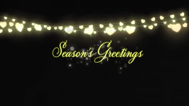 黒を背景に季節の挨拶テキストやクリスマスの妖精のライトの装飾のアニメーション クリスマス お祝いのコンセプトデジタルで生成されたビデオ — ストック動画
