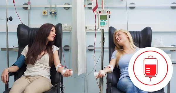 Female Donors Looking While Talking Each Other Hospital Blood Bag — Stockfoto