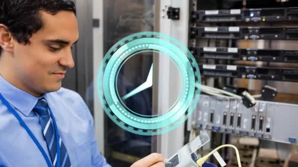 Animation Clock Moving Biracial Male Worker Inspecting Server Room Technology — Stockvideo
