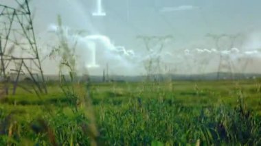 Veri işleme ve peyzaj üzerinde elektrik direkleriyle ikili kodlama animasyonu. küresel bağlantılar, teknoloji, veri işleme ve dijital arayüz konsepti dijital olarak oluşturulmuş video.