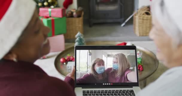 Diverse Senior Female Friends Using Laptop Christmas Video Call Family — Stock Video