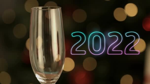 Animatie Van 2022 Tekst Onder Glas Champagne Oudejaarsavond Feest Concept — Stockvideo