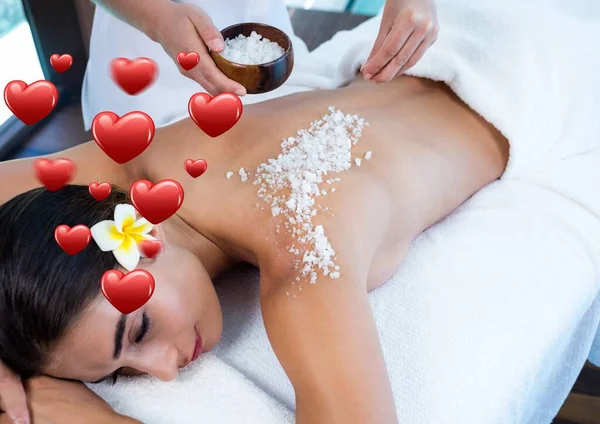 Multiple Red Heart Icons Woman Receiving Salt Scrub Beauty Treatment — 图库照片